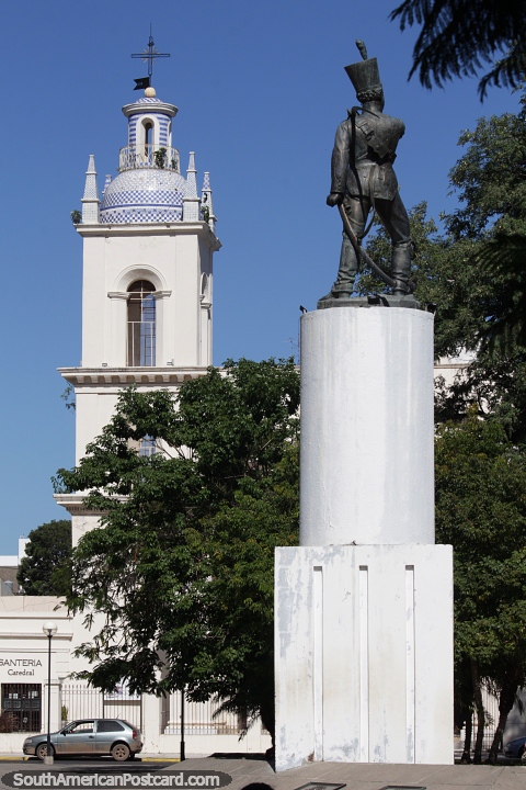 Cathedral tower and statue at Plaza Sargento Cabral in Corrientes. (480x720px). Argentina, South America.