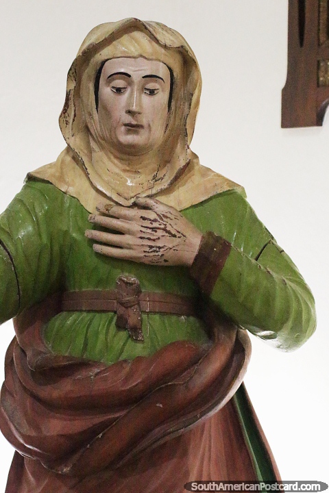 Ceramic figure dressed in green wearing headwear at Dom Diogo de Souza Museum in Bage. (480x720px). Brazil, South America.