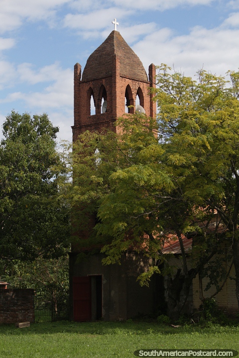 Antique brick tower of the church in Alberdi. (480x720px). Paraguay, South America.