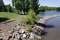 Grassy and green surroundings with clear blue river waters, this is Neuquen.