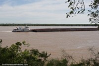 Tugboat pushing a barge along the Parana River in La Paz.