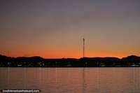 An orange glow sets over Filadelfia at sunset beside the Tocantins River.