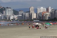 View across several beaches in Santos with apartments behind. 