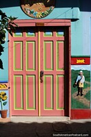 Larger version of Guatape, a town full of colorful facades, doorways, windows and skirtings.