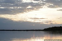 Sunrise comes up over the Paraguay River in Puerto Carmelo Peralta.