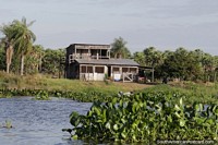 2 storey wooden house beside the Paraguay River in Puerto Carmelo Peralta.