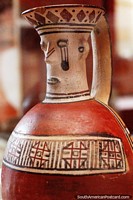 One-handled vessel with a face, ceramic work at the Leymebamba museum.