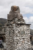 Stone monument with a ceramic figure at the top in San Rafael de Mucuchies.