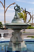 Venezuela Photo - Nice ceramic fountain with a child holding a fish and sitting on one too, Puerto Cabello.