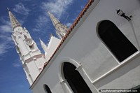 San Juan Evangelista Church in Juan Griego, clock tower and arches.